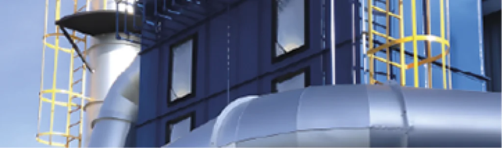 Colector de polvo industrial MCAT instalado en exterior con ductería metálica y escaleras de mantenimiento